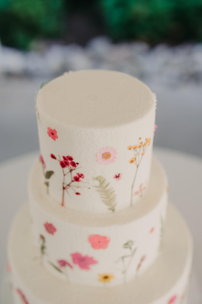 Wedding cake with delicate floral designs.