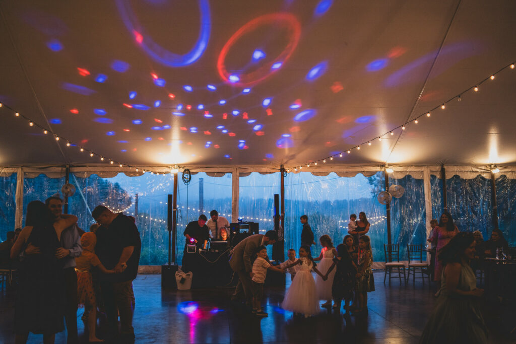Guests on the dance floor under specialty lighting.
