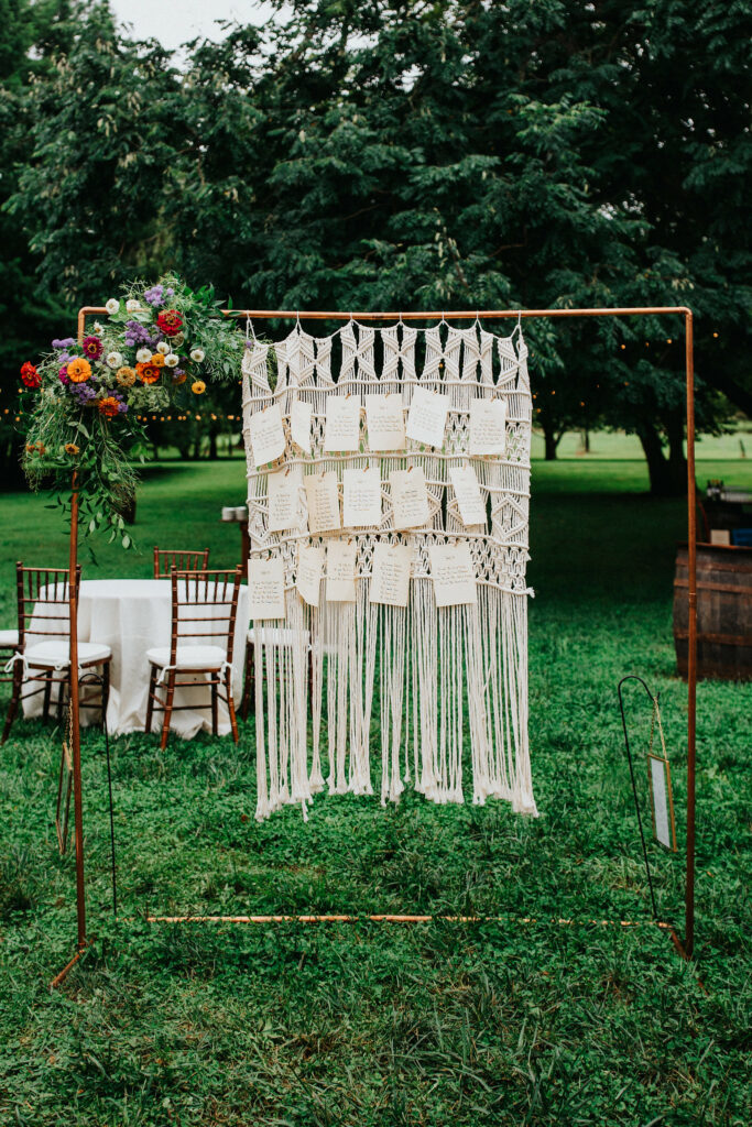 Crocheted hanging art with table places.
