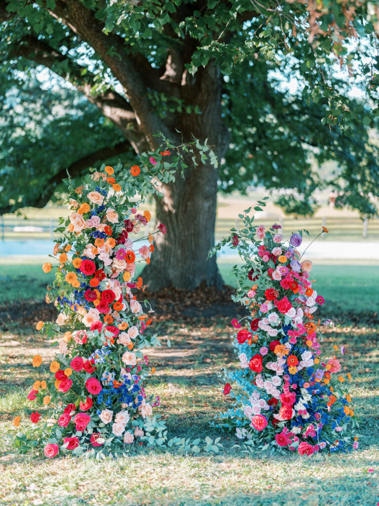 Ceremony floral decor, two floral poles creating an open arch.