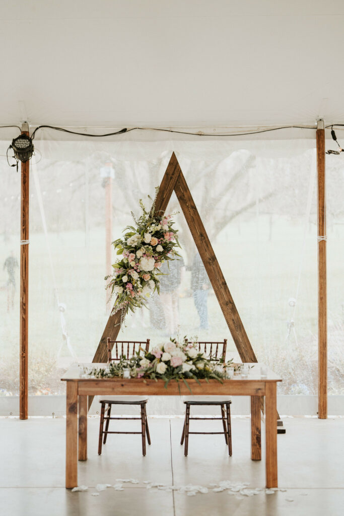 Sweetheart table and backdrop.