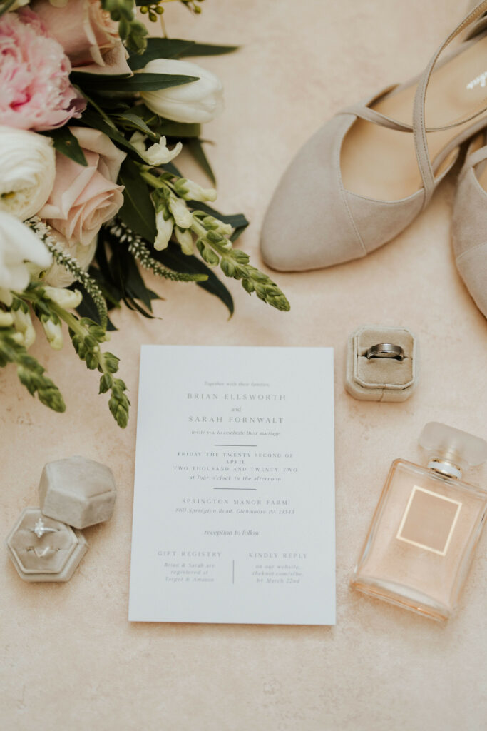 Wedding details, invitation, brides shoes.