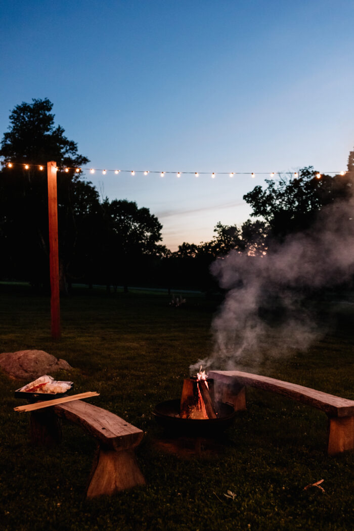 Fire pits lit up at night in Valley View at Springton Manor Farm