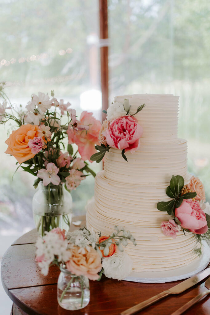 Tiered wedding cake and bouquet.