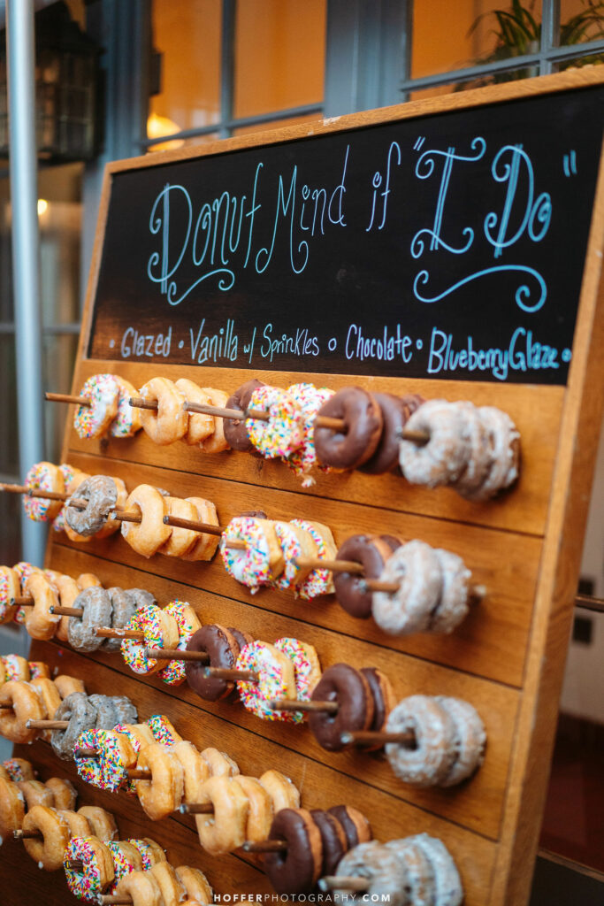 Donut wall with chalkboard sign.