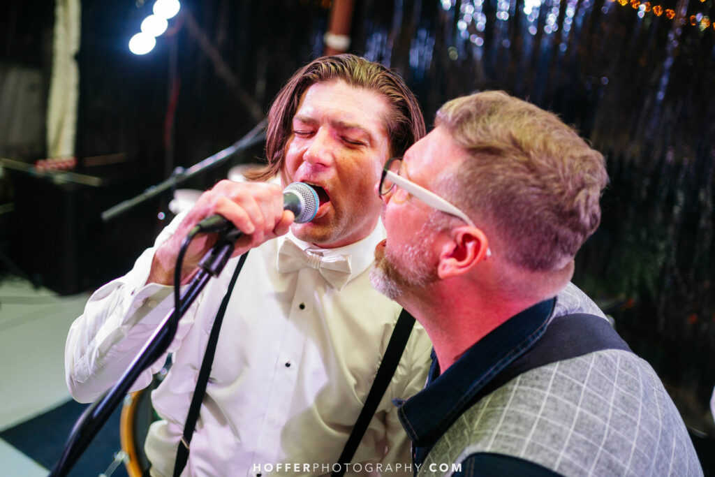 Groom singing with the band.