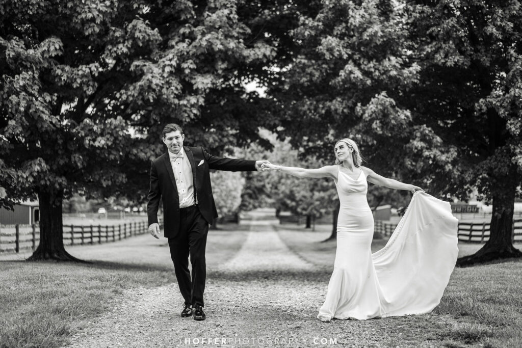 Couple walking up the gravel road.