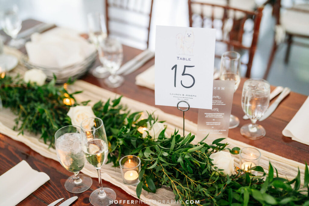 Floral decor on runner with a table number.