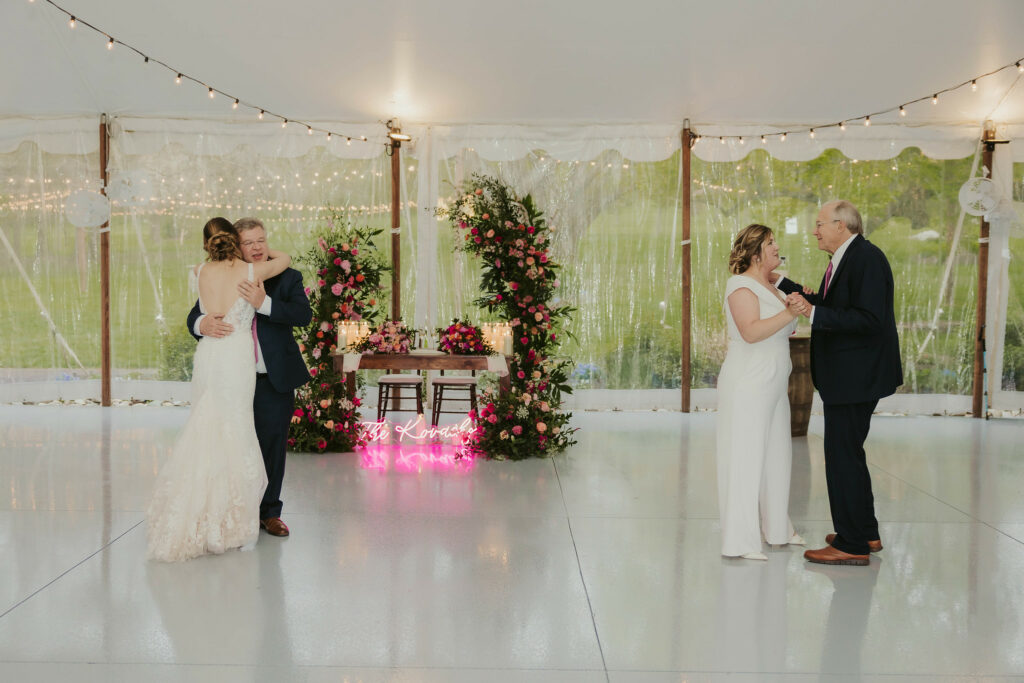 Lily and Megan dancing with their dads.