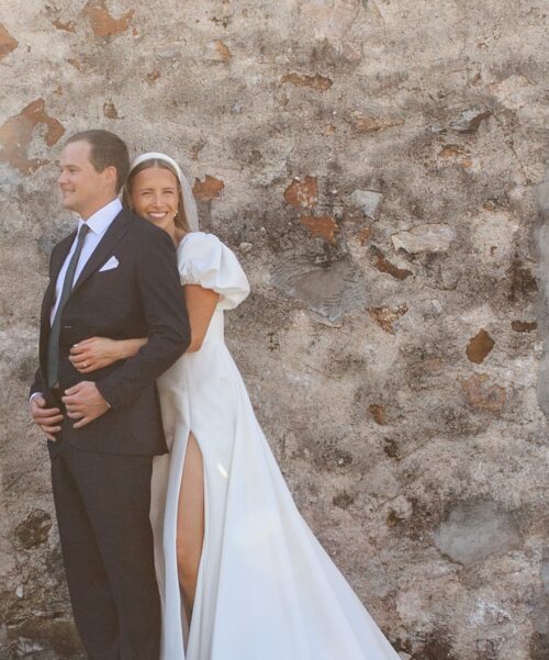 Bride hugging groom